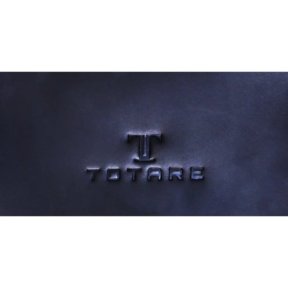 Navy blue leather surface with 'TOTARE' branding