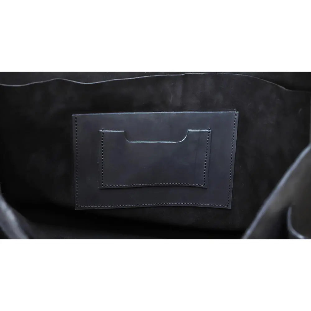 Close-up of a black leather patch on a dark background