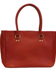 Red handbag with gold hardware on a white background