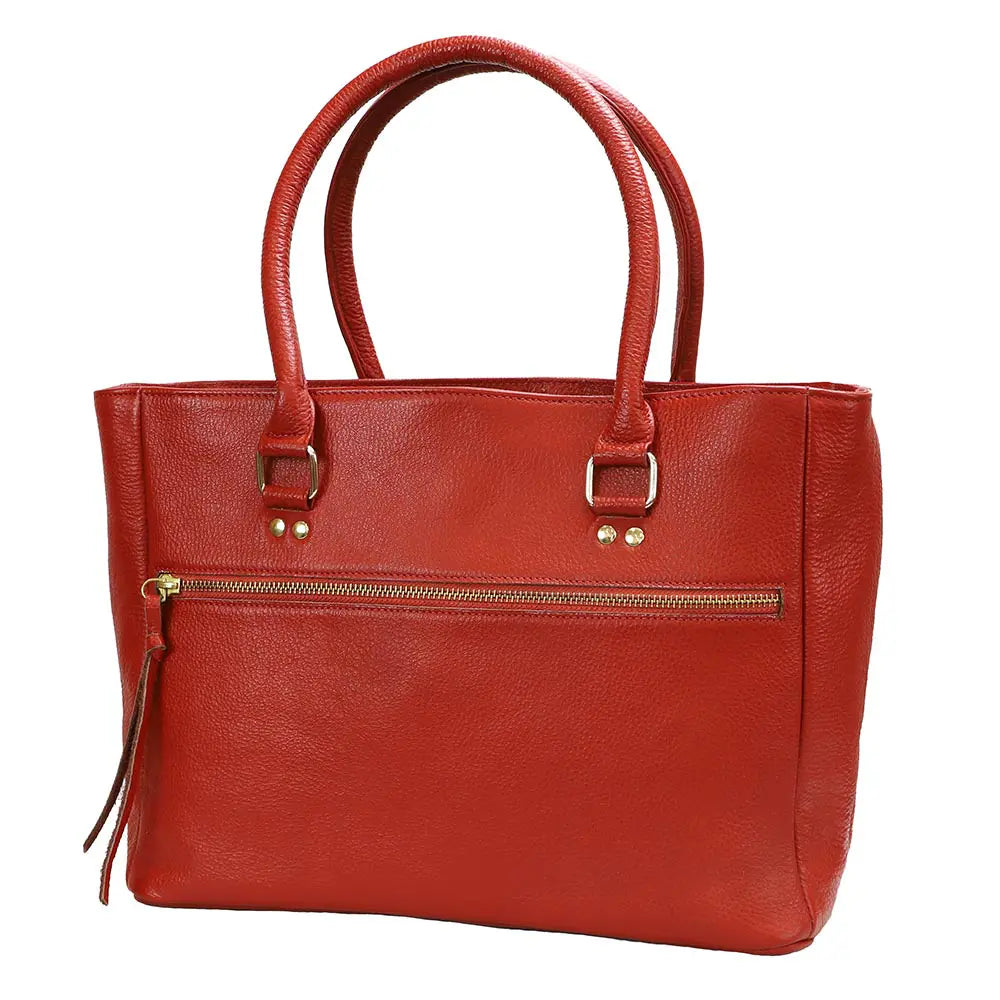 Red leather handbag with gold accents on a white background