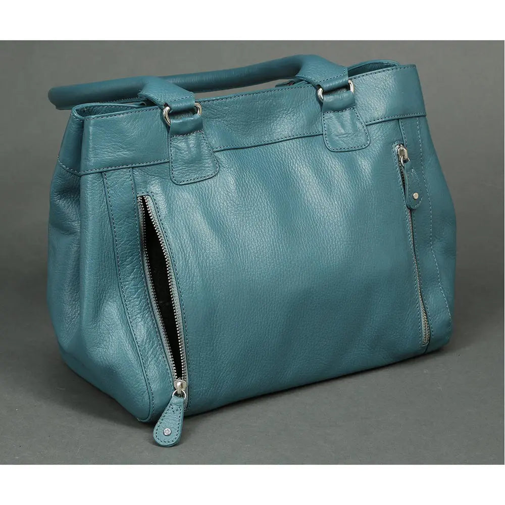 Teal handbag on a gray background