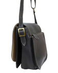 Black leather bag with a gold buckle on a white background