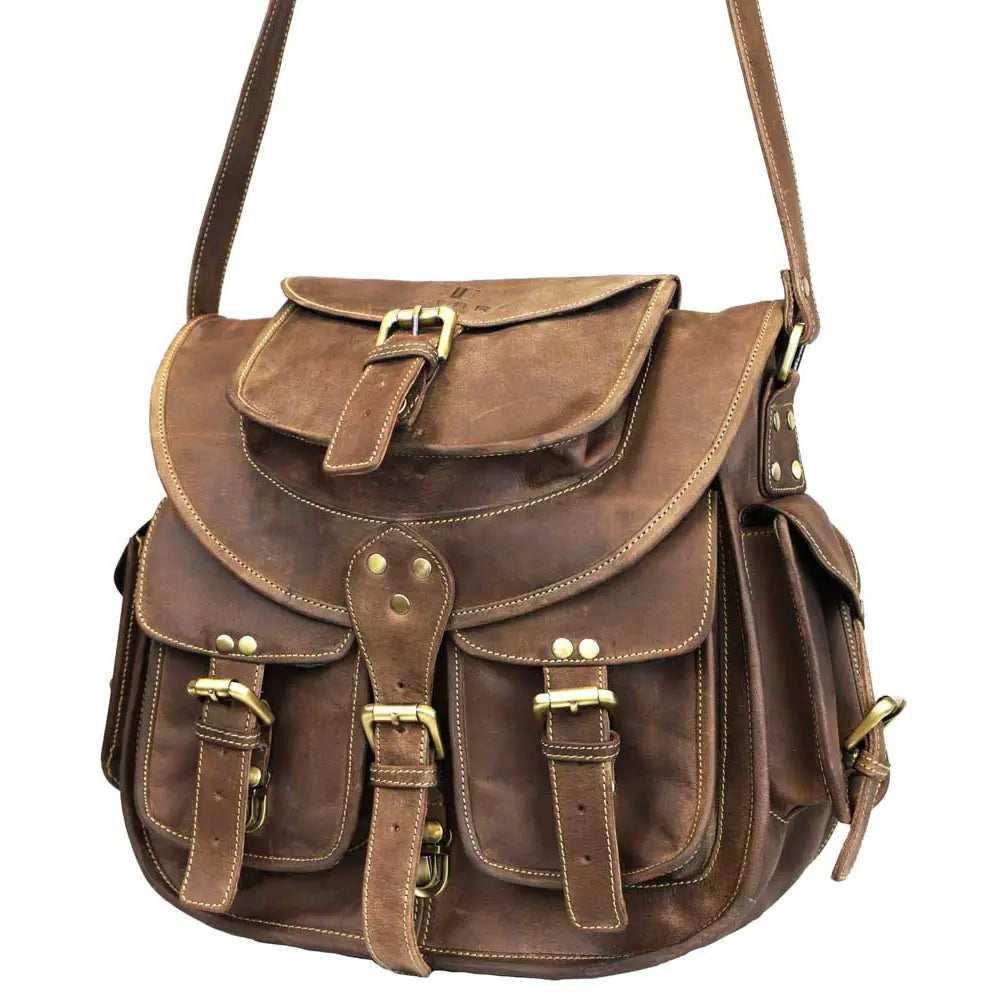 Brown leather satchel bag with gold buckles on a white background