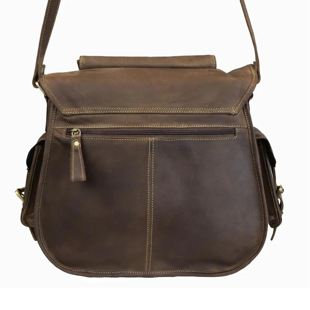 Brown leather bag with a shoulder strap on a white background