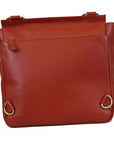 Red leather handbag with gold accents on a white background
