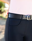 Black riding pants with a black belt featuring a silver buckle.