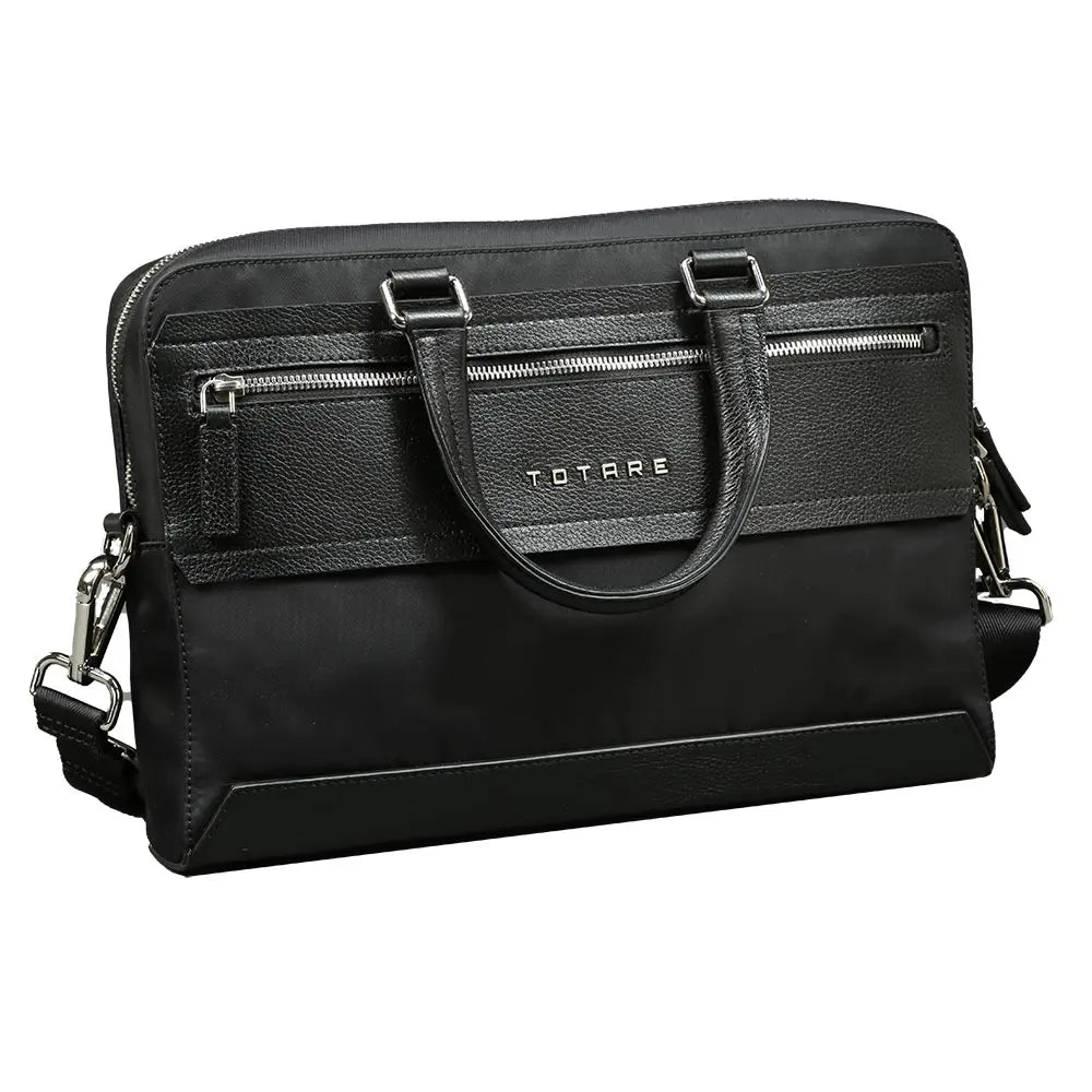 Black leather briefcase with silver zippers and hardware on a white background