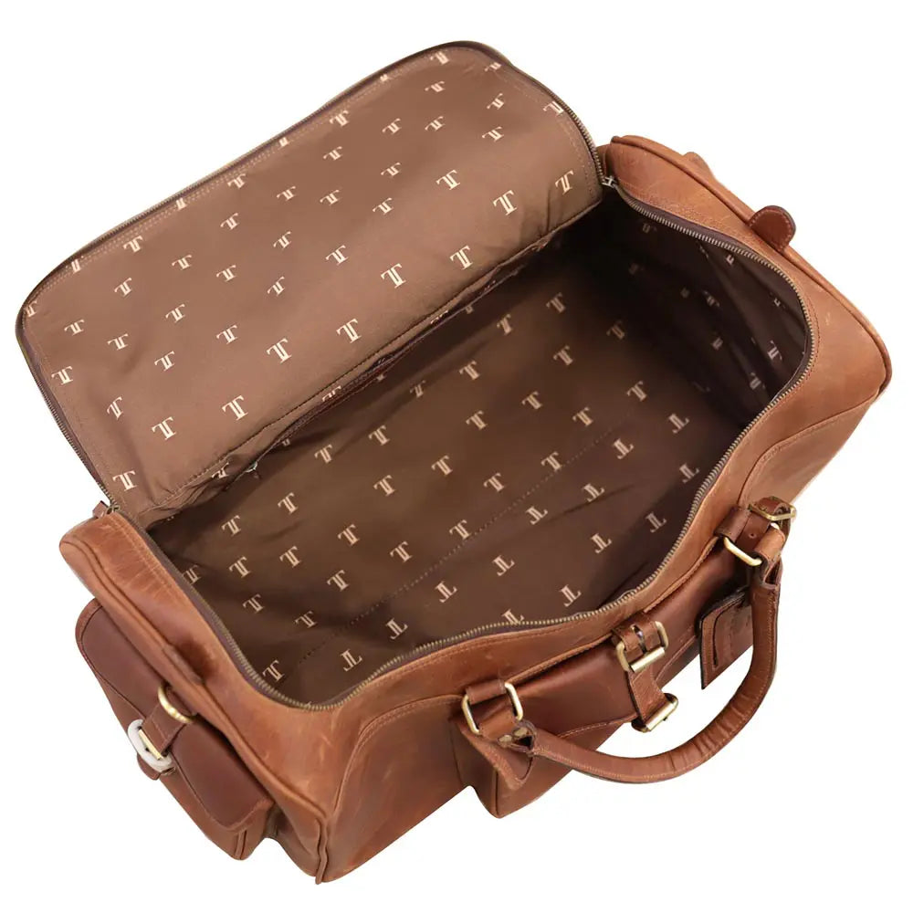 Brown leather bag with gold accents on a white background