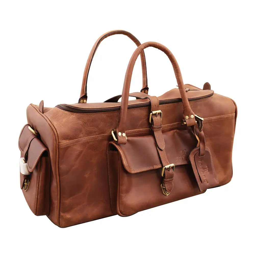 Brown leather duffel bag with gold hardware on a white background