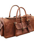 Brown leather duffel bag with gold hardware on a white background