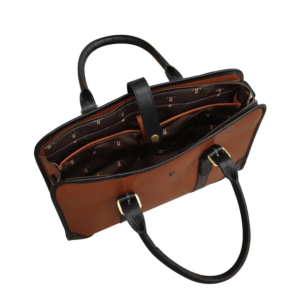 Brown leather handbag with black handles and strap on a white background