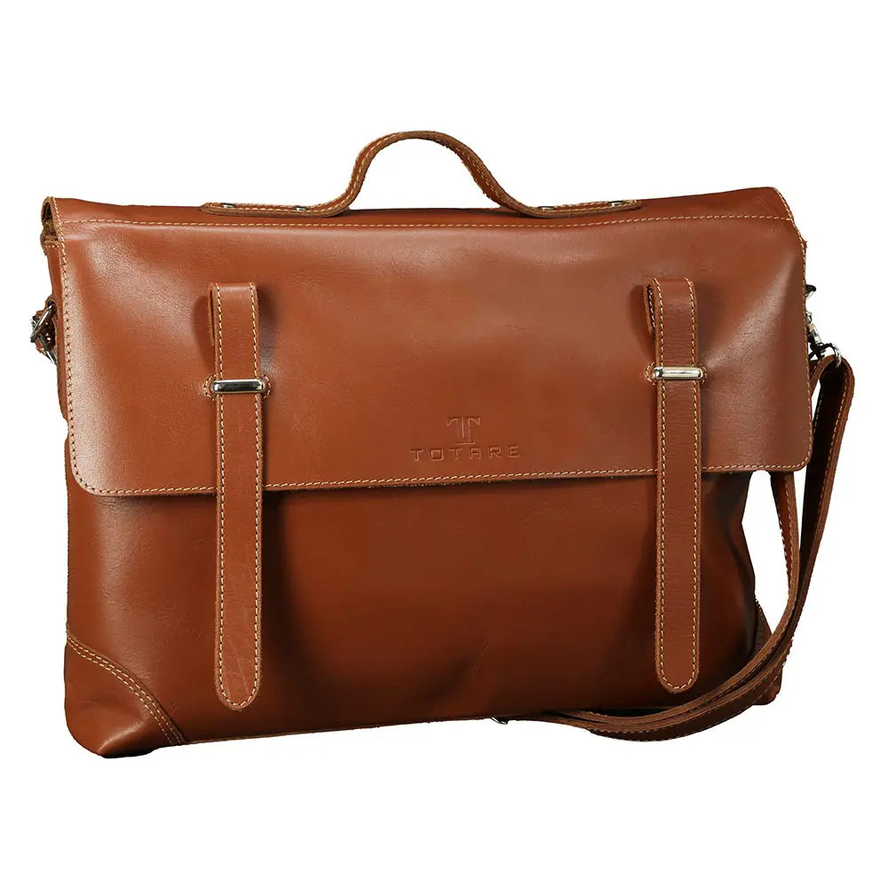 Brown leather bag with shoulder strap on a white background