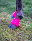 Close up of Pink Safety Step Bell Boots on horse