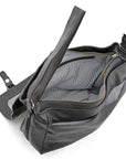 Black shoulder bag with a zipper on a white background