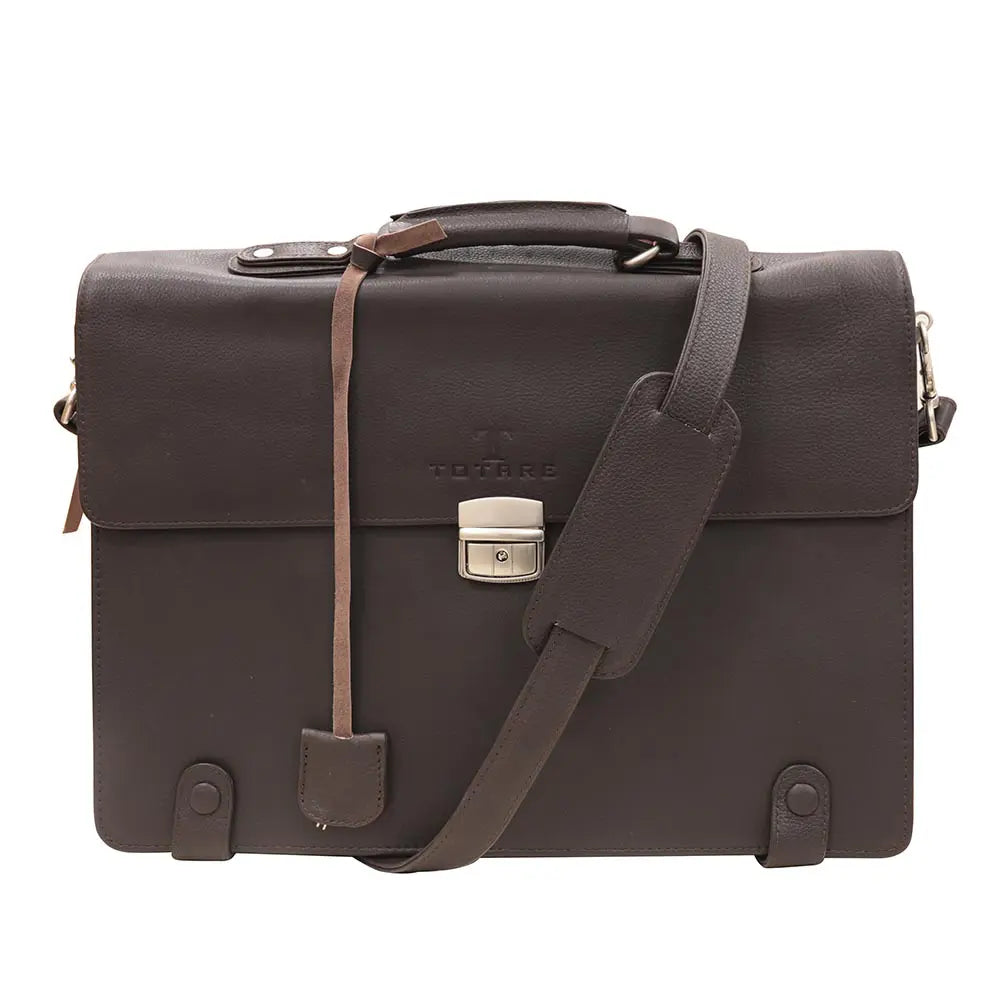 Brown leather briefcase with shoulder strap on a white background