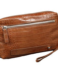 Brown crocodile-patterned clutch bag with a wrist strap on a white background