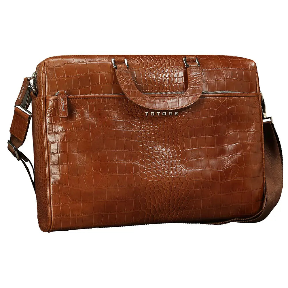 Brown leather briefcase with crocodile texture on a white background