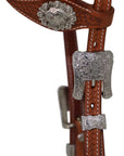 Brown leather headstall with silver metal hardware on a white background