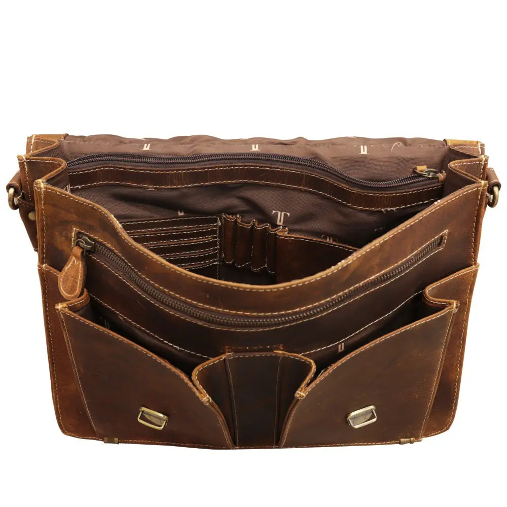 Brown leather bag with multiple compartments and zippers on a white background