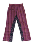 Purple plaid pants with a black and white pattern on a white background