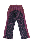 Plaid pants with leopard print pattern on a white background