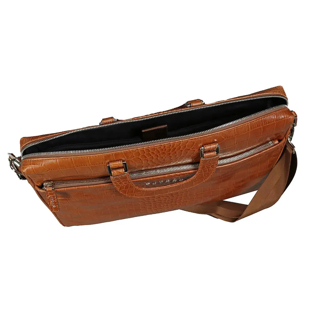Brown leather bag with multiple zippers on a white background