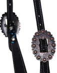 Black leather belt with decorative buckle on a white background