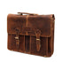 Brown leather satchel bag with gold buckles on a white background